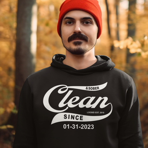 Man wearing recovery hoodie with custom sobriety date outdoors