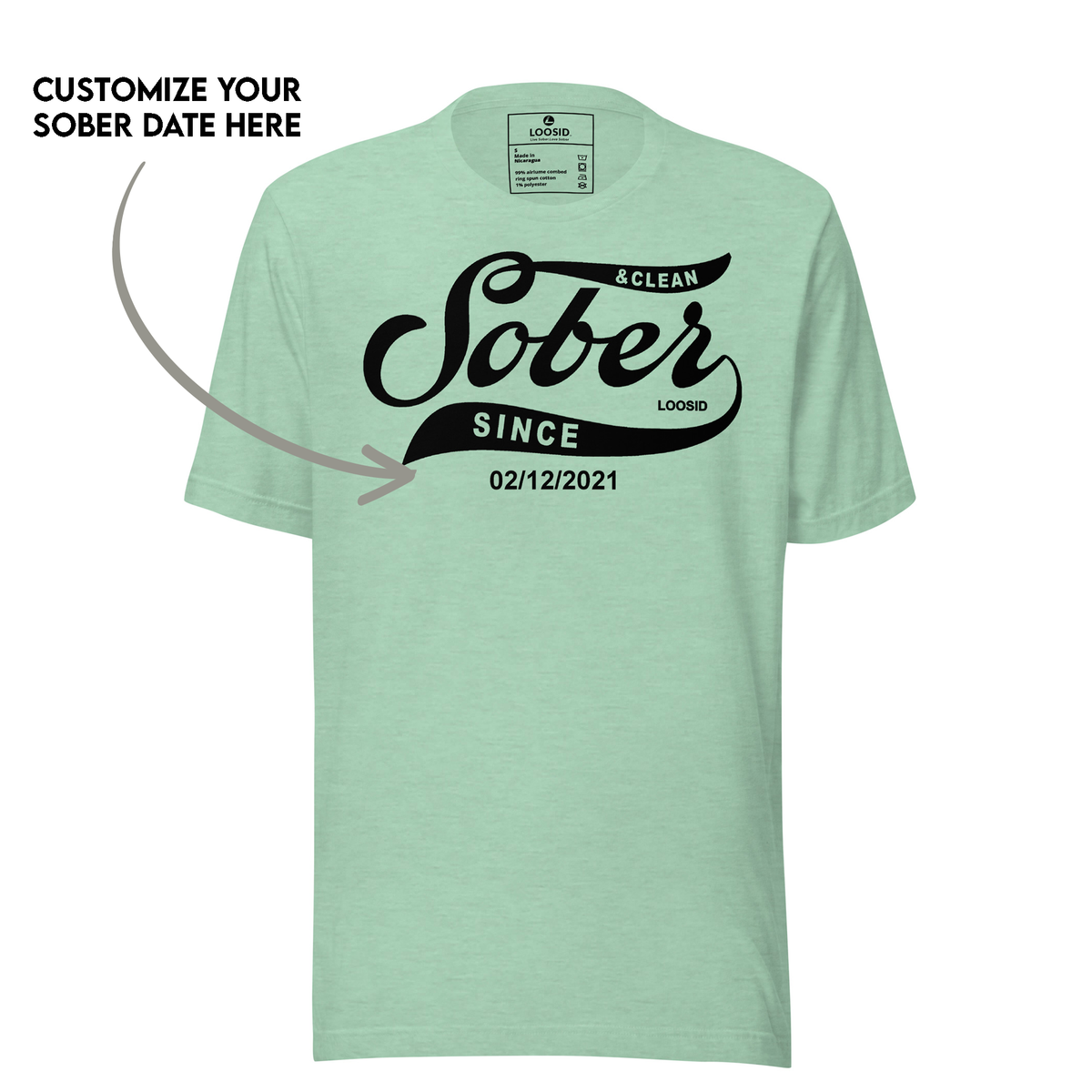 Personalized sobriety t shirt laid flat on wooden surface