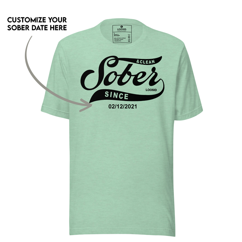 Personalized sobriety t shirt laid flat on wooden surface