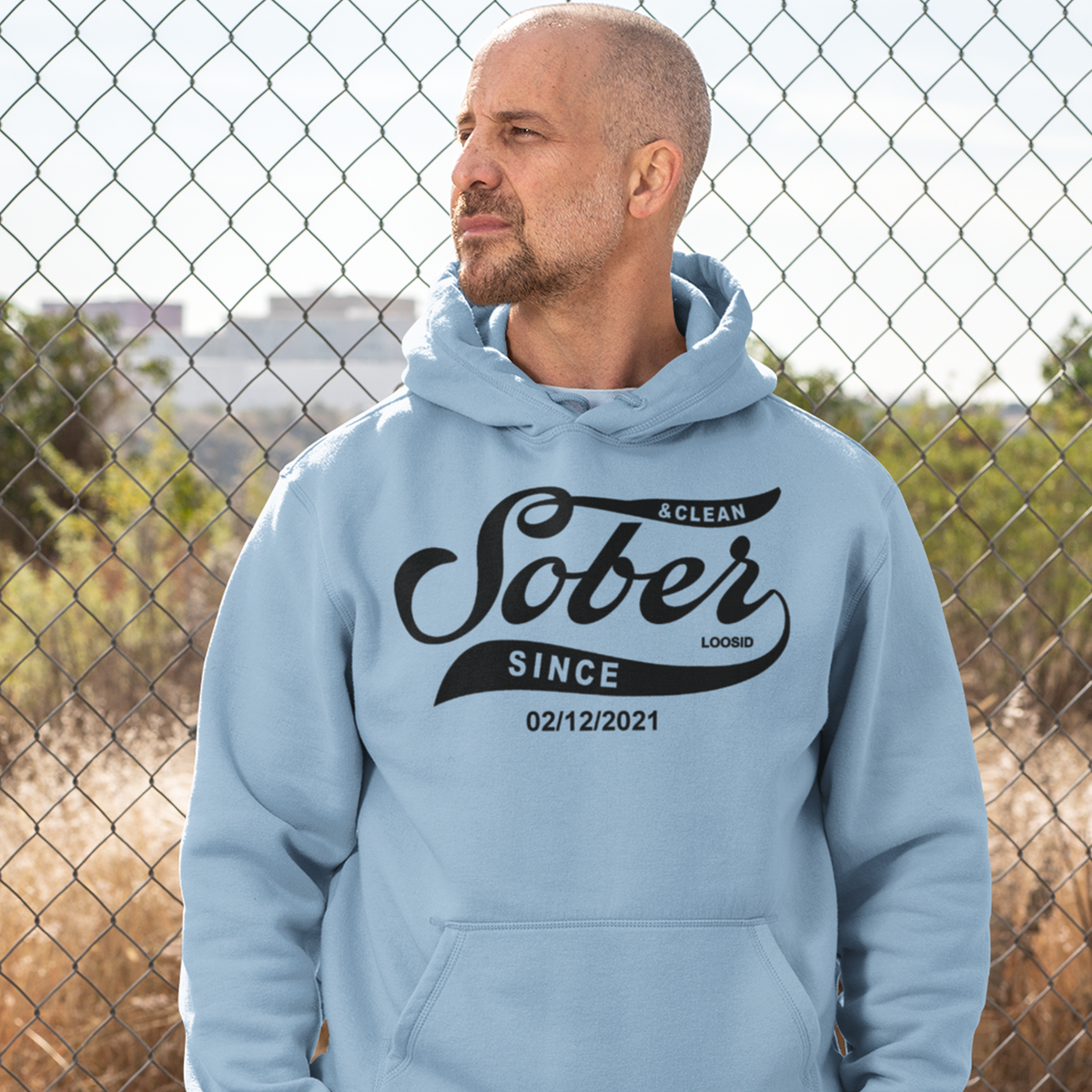 Person wearing a recovery hoodie with personalized sober date