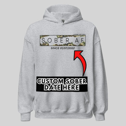 Sober AF Camo Recovery Hoodie flat lay styled image (view 23)