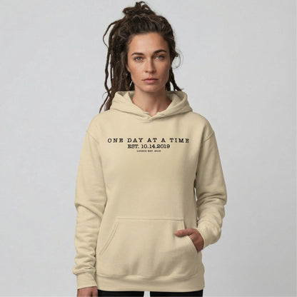 One Day At a Time Recovery Hoodie flat lay styled image (view 13)